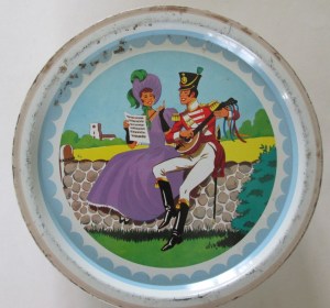 The Quality Street Soldier plays the lute whilst the Lady holds the music