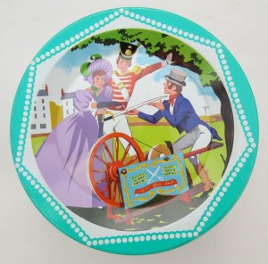 The Quality Street Soldier & Lady at the knife grinders, he getting his sword sharpened