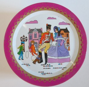 The Quality Street Soldier and Lady sitting on a bench