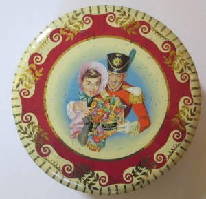 The Soldier & Lady with an overflowing tin of Quality Street