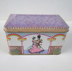 The Quality Street Soldier & Lady dancing in a pergola