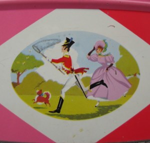 The Quality Street Soldier & Lady chase butterflies