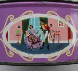 The Quality Street Soldier watches the Lady spinning