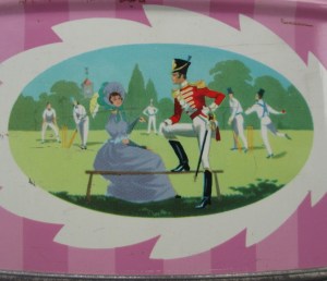 The Quality Street Soldier & Lady watch a cricket match