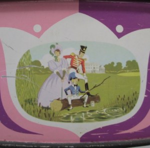 The Quality Street Soldier & Lady watch the Boy fishing