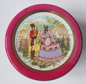 The Quality Street Soldier & Lady meet in a garden
