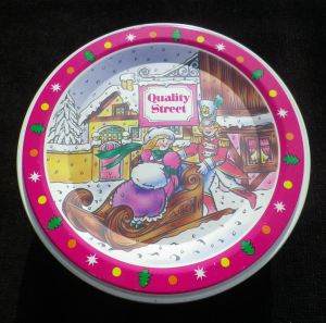 The Quality Street French Soldier & Lady children on a sleigh