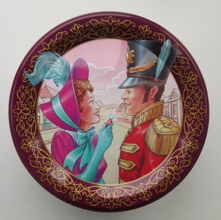 The Quality Street Lady in a striking purple bonnet