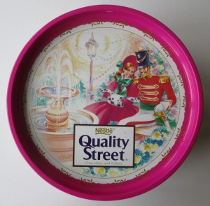 The Quality Street Soldier & Lady site by a fountain